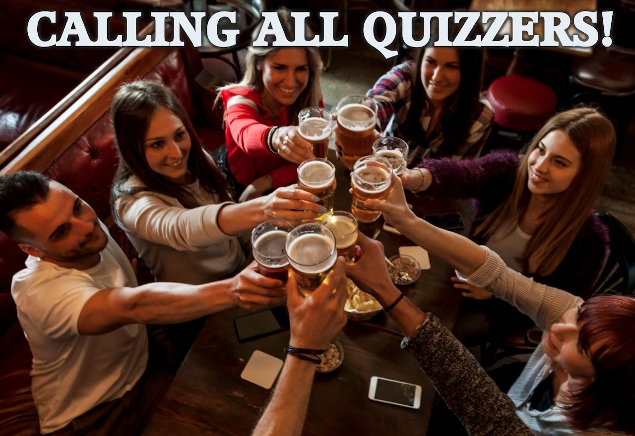 Calling all quizzers! Friends raising their glasses round a pub table
